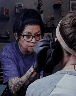 Sam marking a piercing at the Fayetteville NC location