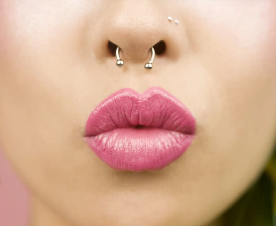 Circular barbell septum piercing jewelry — American Tattoo Society piercing aftercare